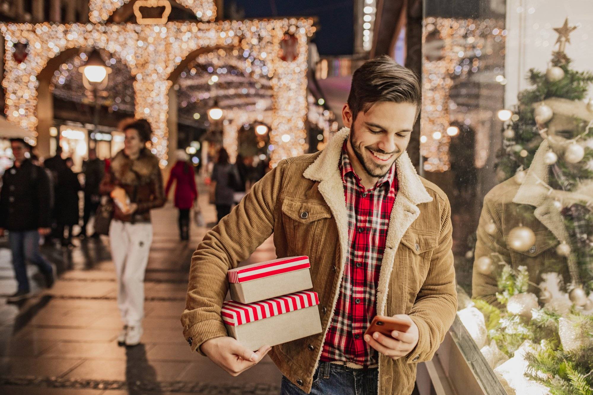 Young man in Christmas shopping Young man in Christmas shopping