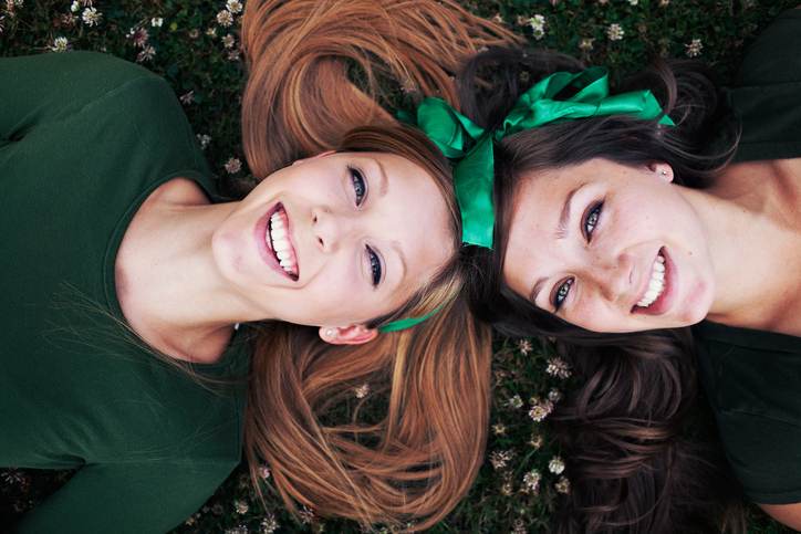 Sisters Laughing and Laying Down